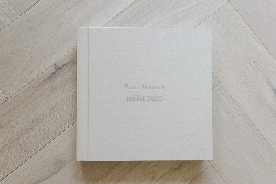 Floricolor linen cover photo albums in neutral tones on wooden surface Geneva