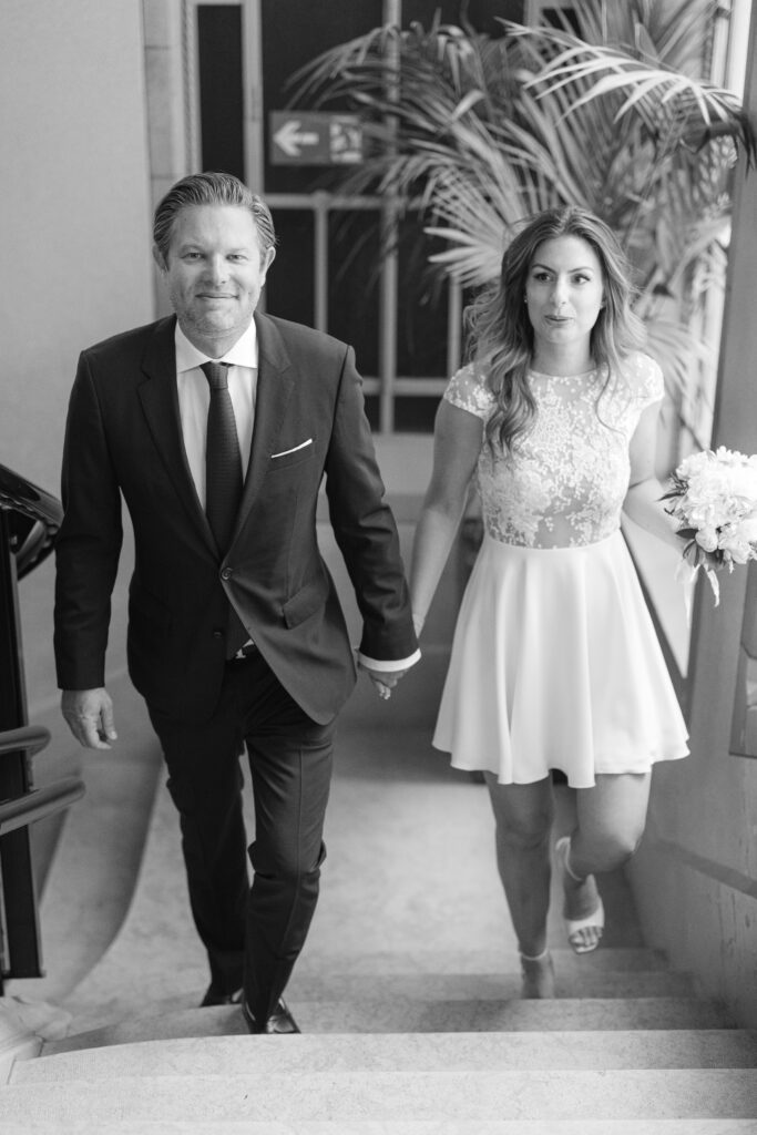 Bride and groom arriving hand in hand at Mairie des Eaux-Vives, civil wedding Geneva