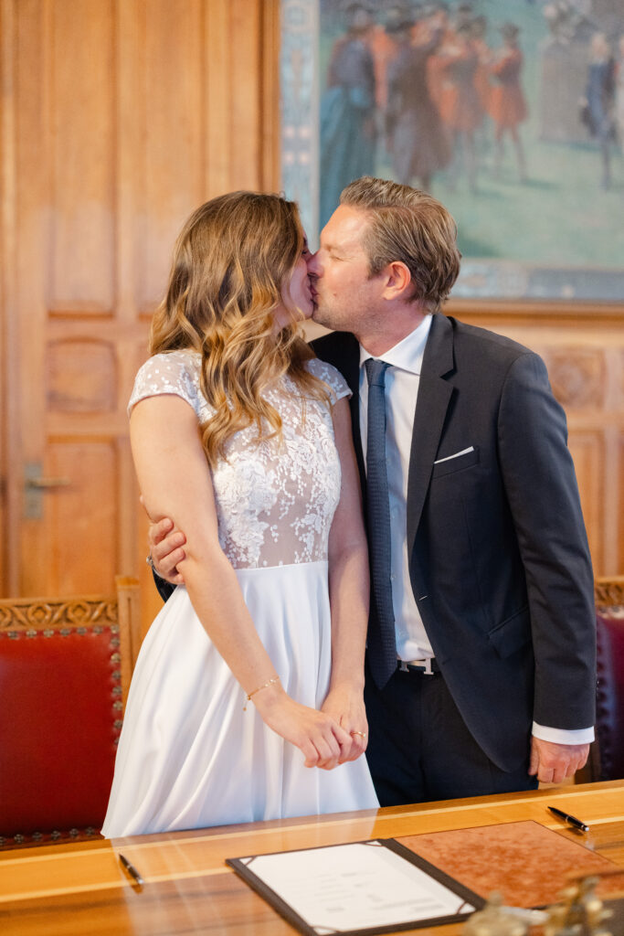 Bride and groom first kiss at Mairie des Eaux-Vives civil wedding Geneva