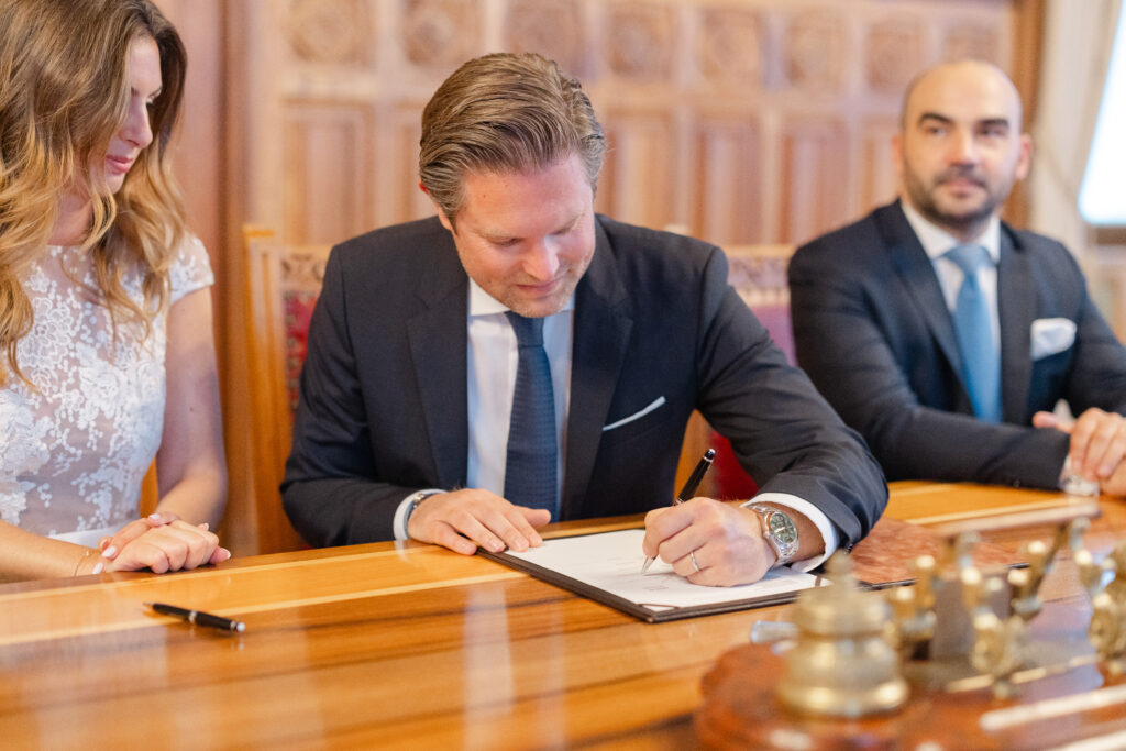 Couple signing the wedding register at Mairie des Eaux-Vives Geneva