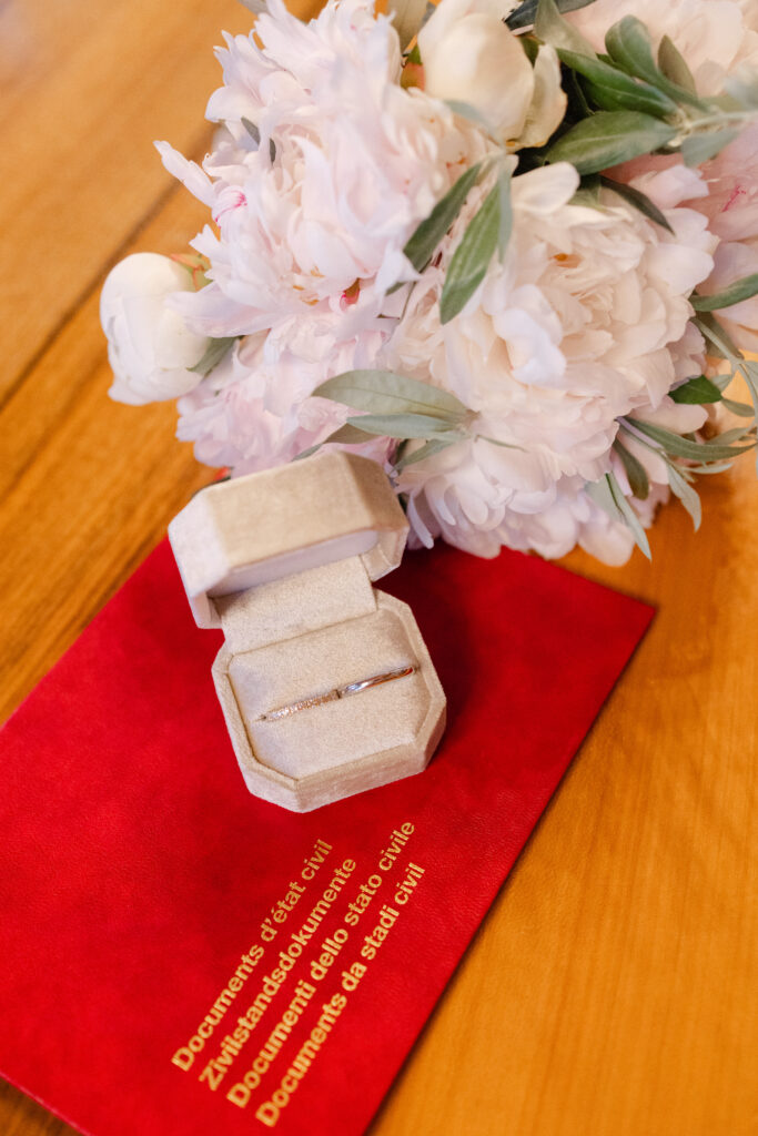 Bridal bouquet and Swiss civil register document at Geneva civil wedding