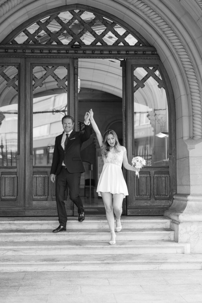 Bride and groom exiting Mairie des Eaux-Vives after civil wedding Geneva