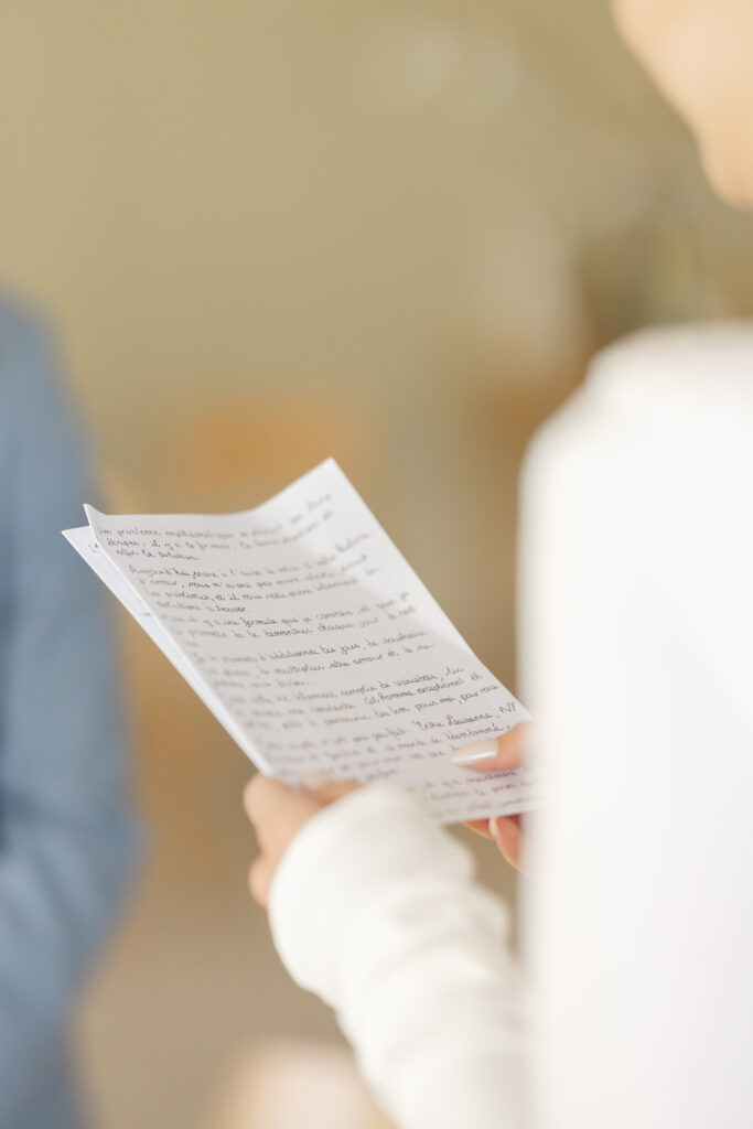 Bride reading handwritten vows at civil wedding Mairie de Lancy Geneva