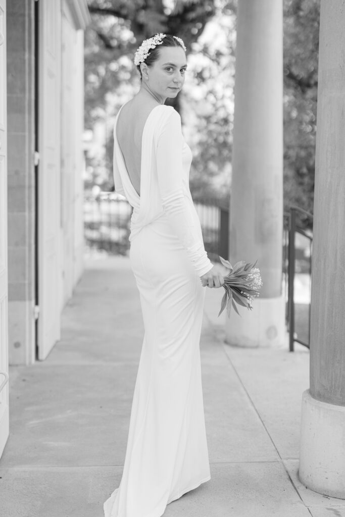 Black and white portrait of bride with columns at Mairie de Lancy Geneva