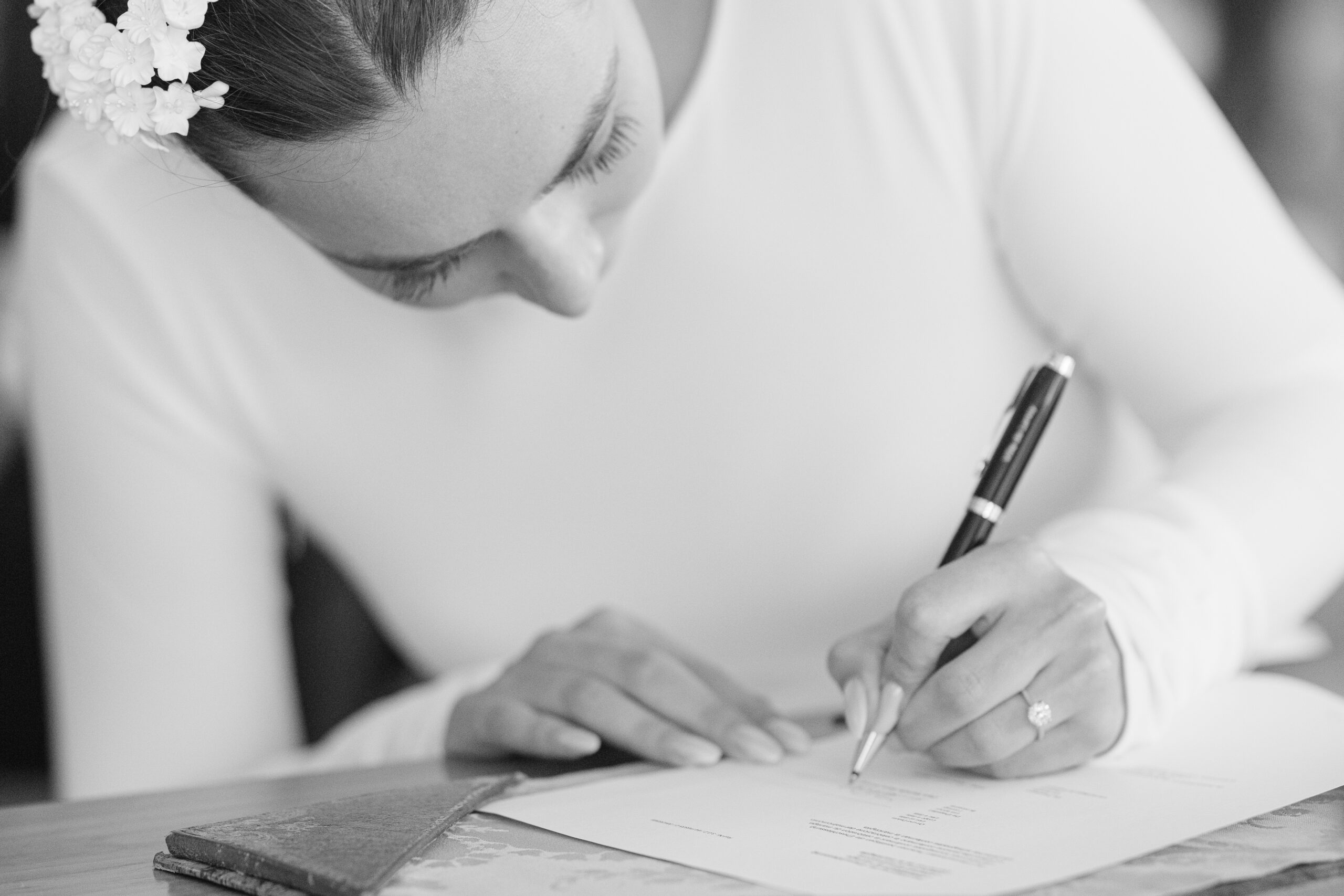 Bride signing the wedding register at Mairie de Lancy Geneva civil wedding