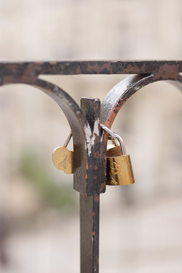 Close up of golden love lock in Montmartre Paris during couple photo session