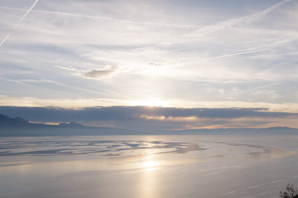 Golden sunset over Lake Geneva during engagement session in Lavaux Switzerland