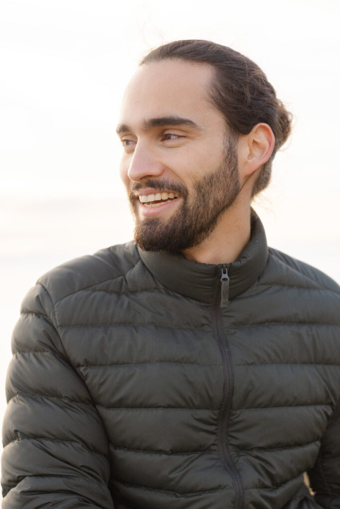 Natural portrait of groom smiling during engagement session in Lavaux Switzerland