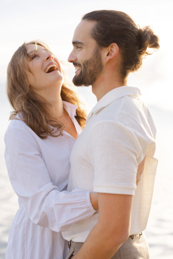 Couple laughing together during engagement session at Lake Geneva Switzerland