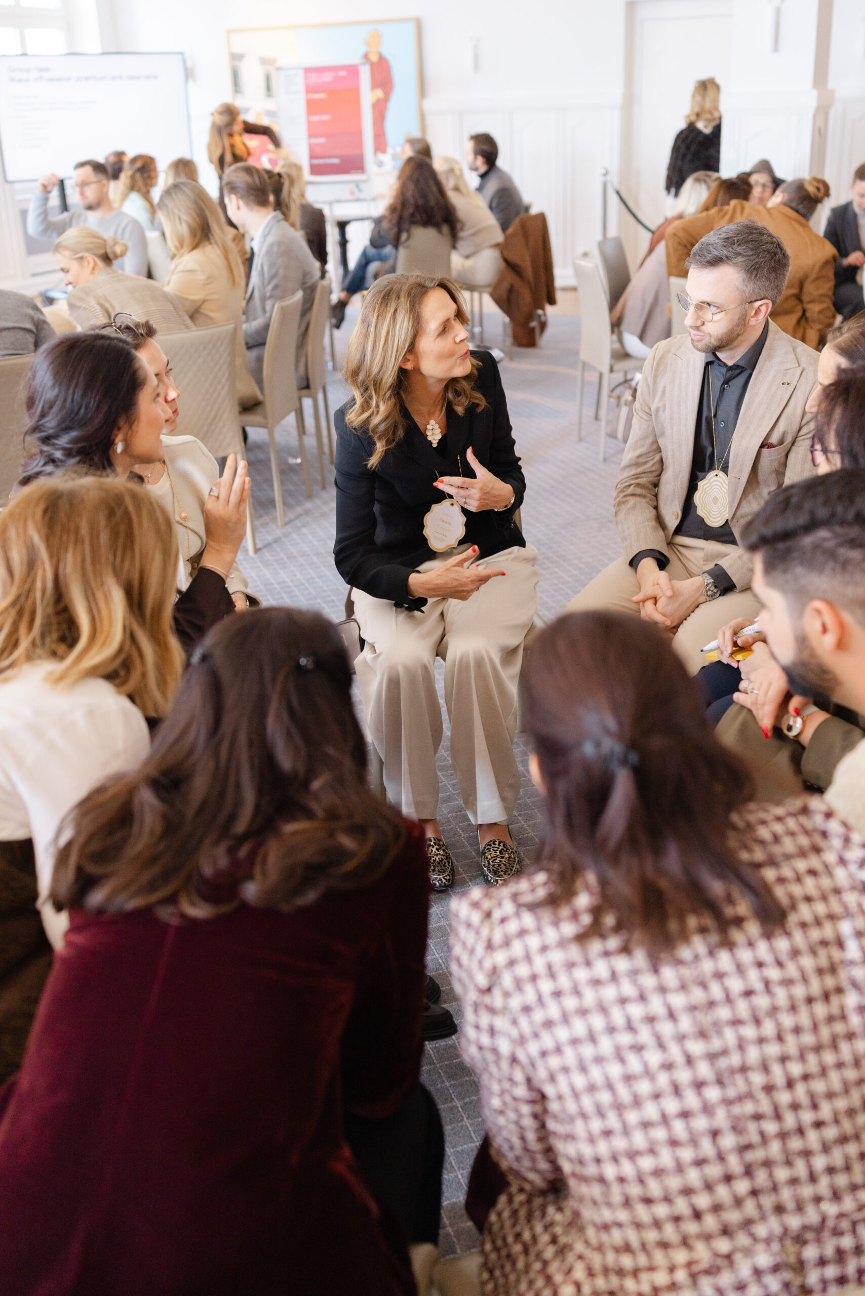 Attendees networking and exchanging during a corporate event in Geneva, photographed by Mathilde Ballet