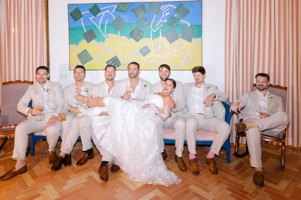 Bride and groomsmen having fun indoors on rainy wedding day Mallorca